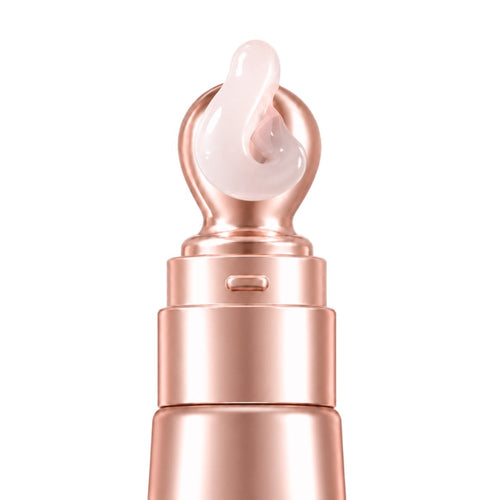 Rose-gold applicator tip with a swirl of serum