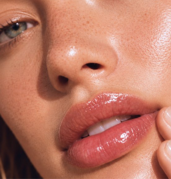 Close-up of glossy, naturally smooth lips