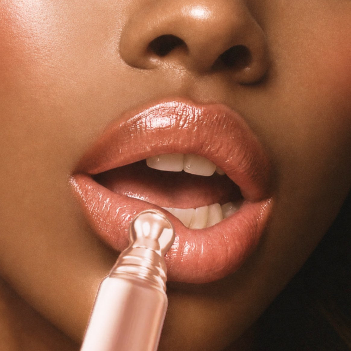Applying Rosé Hour serum to glossy lips